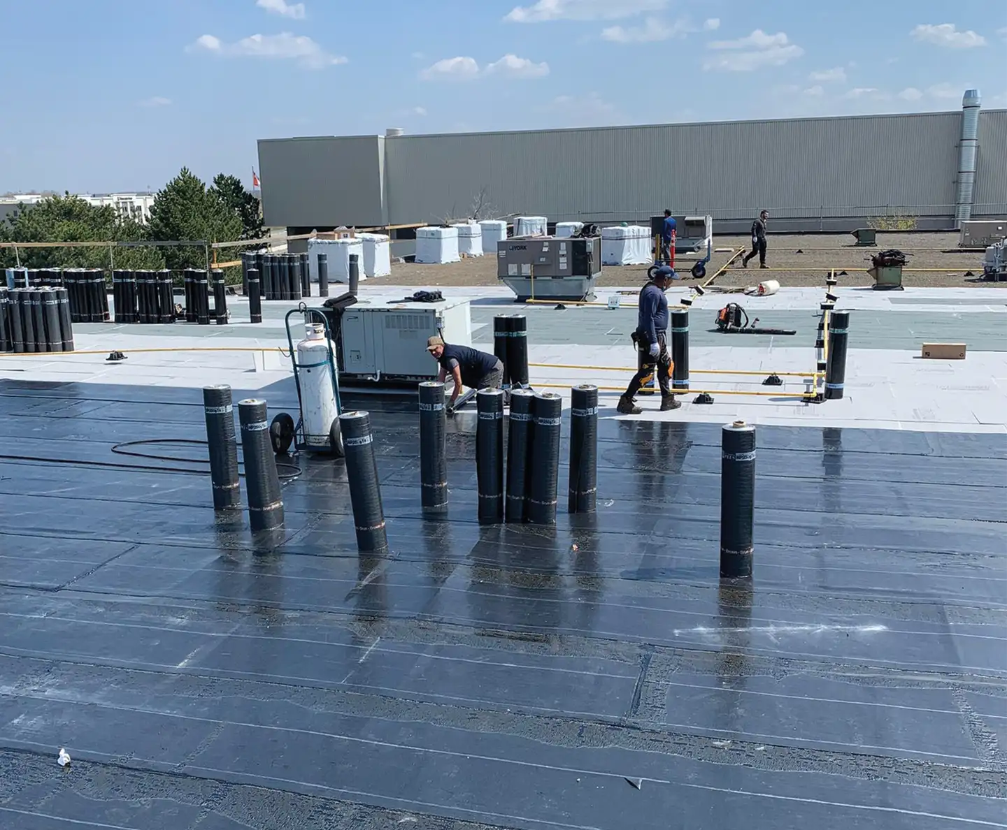 Flat commercial roof installed by The Roofers