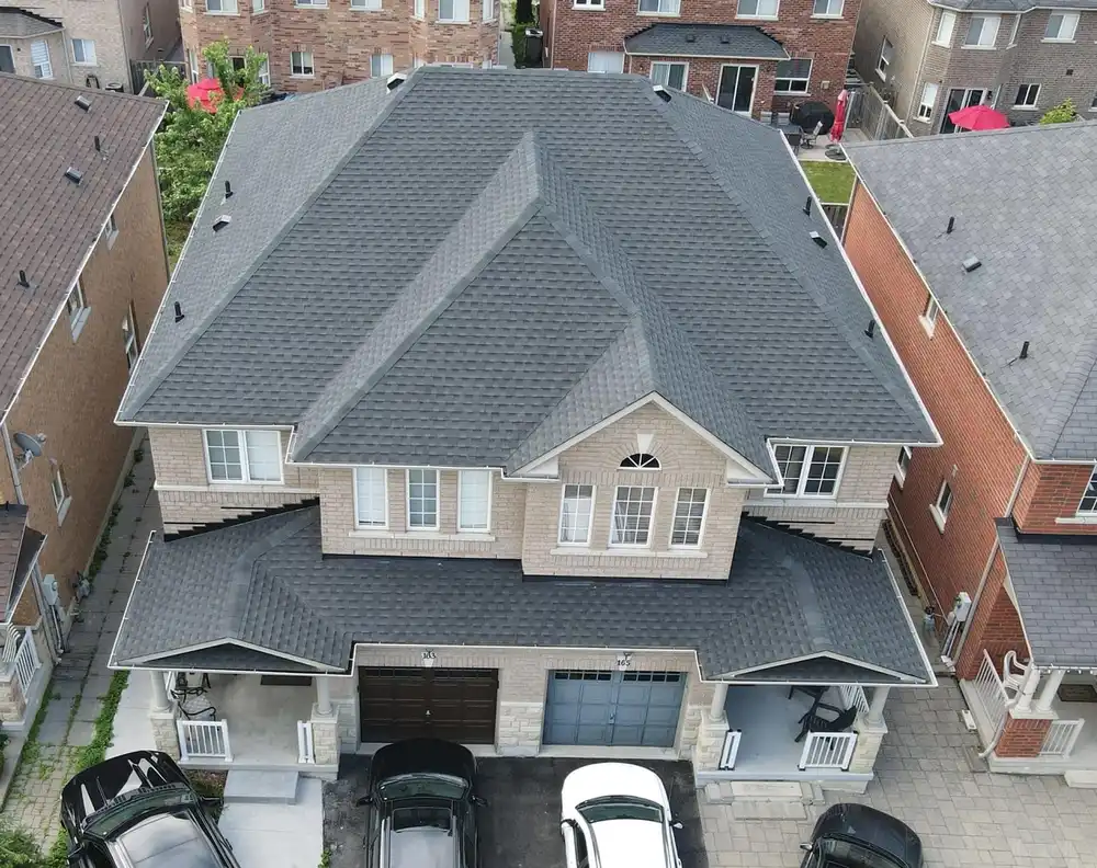 Roofing crew completing a shingle install